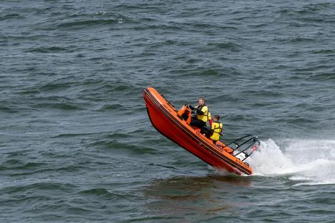 Coat guards fast riding Stock-Fotos