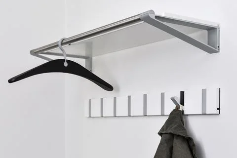 Coat rack on white wall background Stock Photos