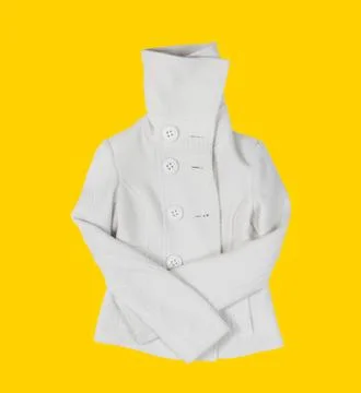 Coat on the yellow background Stock Photos