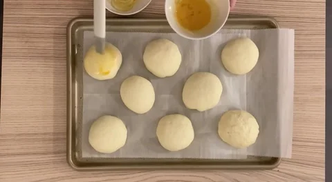 Coating and decorating lemon bun to prepare for baking Video stock 314117318