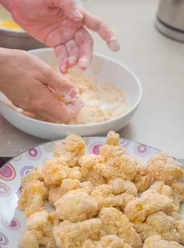 Coating Cauliflower in Breadcrumbs Stock Photos