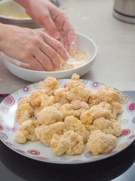Coating Cauliflower in Breadcrumbs Stock Photos