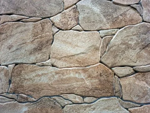 Coating texture mimicking artificial stone in a natural setting with warm t.. Stock Photos