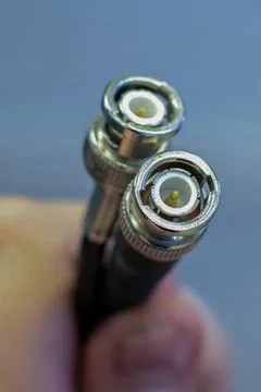 Coaxil wire two outputs in the hands close-up Stock Photos