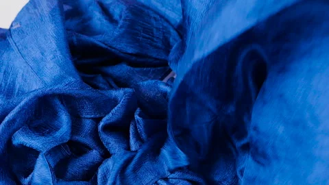 Cobalt blue raw silk fabric gracefully drops down in slow motion.  Vídeo Stock 337403518