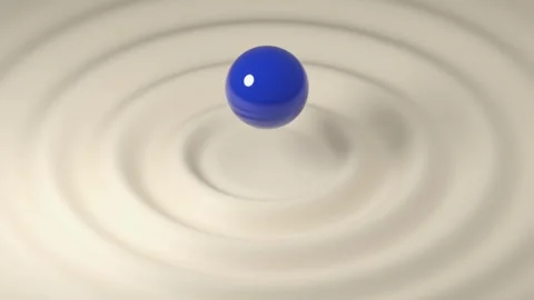 Cobalt blue spheres float above concentric rippling water Vídeo Stock 346210349