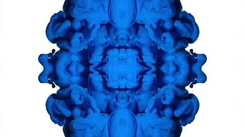 Cobalt ink forms a mirrored console-like shape on white Stock Footage 338108056