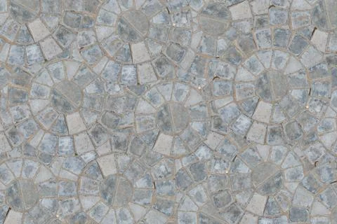 Cobble circular pattern block pavement texture background. Top view Stock Photos
