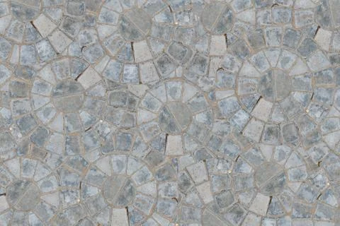 Cobble circular pattern block pavement texture background. Top view Stock Photos