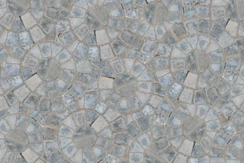 Cobble circular pattern block pavement texture background. Top view Stock Photos