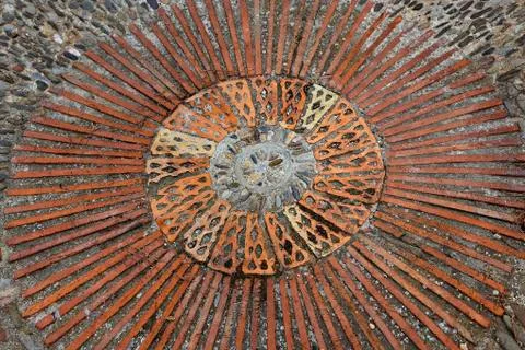 Cobble concentric mosaic. Patterned floor walkway in the park. Stock Photos