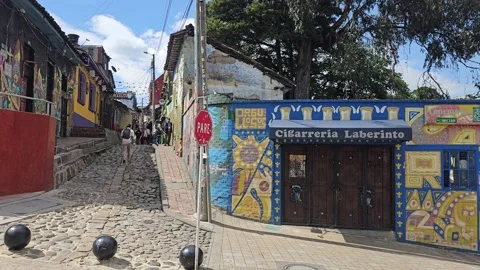 Cobbled Corner With Labyrinth Mural Door and Bollards, Colombia 8K Stock Footage 331524772