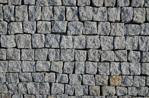Cobbled pavement Cobbled pavement pattern made of granite cubes. Copyright... Foto stock