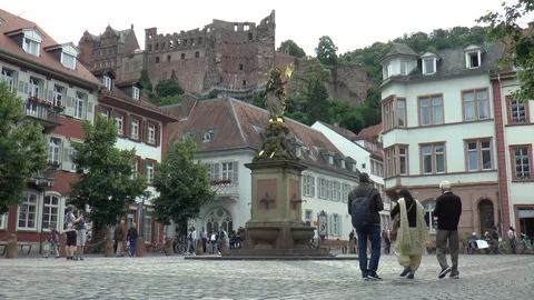 Cobbled Square with Statue and Heidelberg Castle in Background Stock Footage 82967069