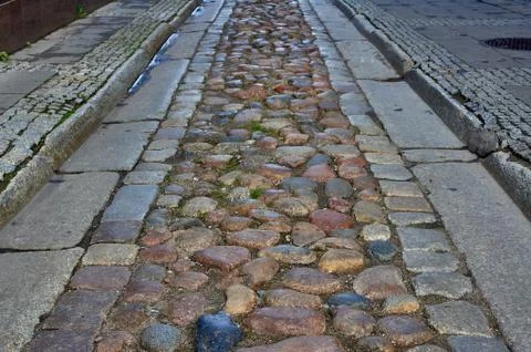 Cobbled street from the gutter Stock Photos