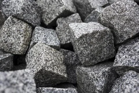 Cobblestone blocks texture background . Grey granite cubes background Stock Photos
