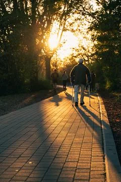 Cobblestone path and passers-by Stock Photos