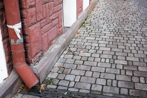 Cobblestone path leading to a charming building in the city Stock Photos