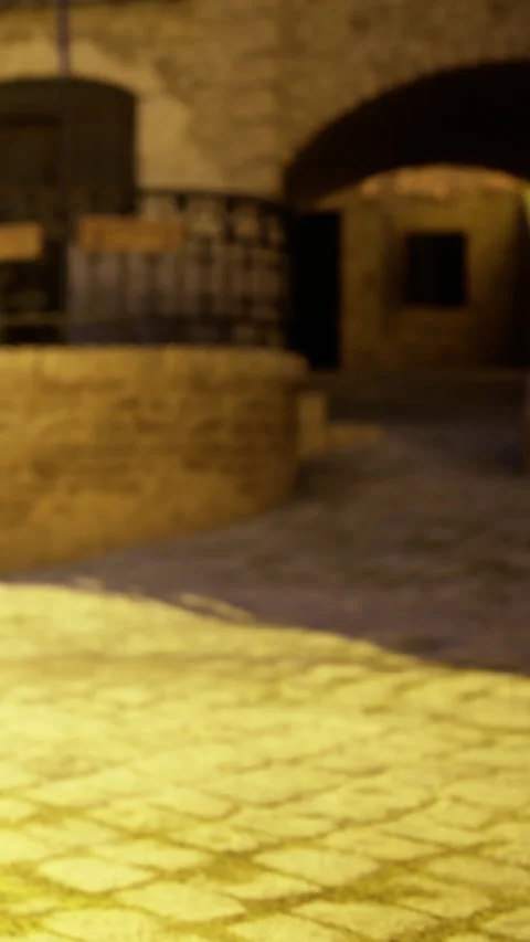 Cobblestone path leads to a stone building in a small town at dusk Stock Footage 331769749