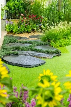 Cobblestone pathway in the garden. Stock Photos