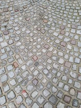 Cobblestone pattern on the floor in the city Stock Photos