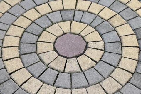 Cobblestone pattern with rocks being arranged in circle Stock Photos