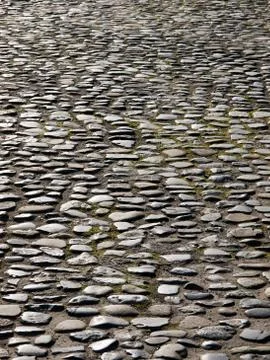 Cobblestone paved road texture Stock Photos