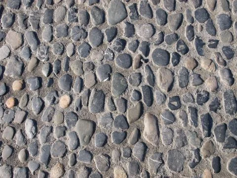 Cobblestone paved road texture Stock Photos
