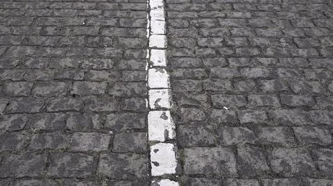 Cobblestone paved road texture with white road marking 写真素材