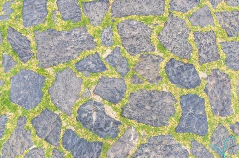 Cobblestone pavement background with copy space. Abstract old close-up cobble Fotos de archivo