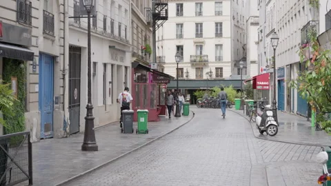 Cobblestone pavement stretches down Rue Rene Boulanger street in the morning Stock Footage 336721976