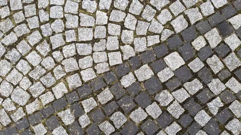 Cobblestone pavement texture background. Cobblestone pavement background. Stock Photos