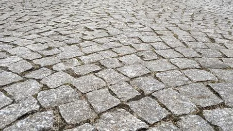 Cobblestone pavement texture background. Cobblestone pavement background. Stock Photos