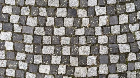 Cobblestone pavement texture background. Cobblestone pavement background. Stock Photos