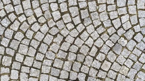 Cobblestone pavement texture background. Cobblestone pavement background. Stock Photos