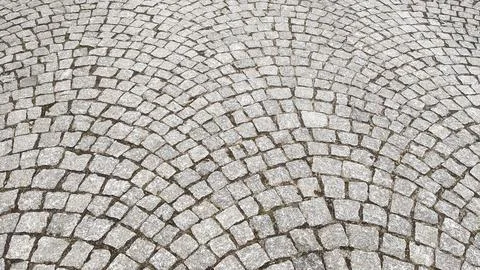 Cobblestone pavement texture background. Cobblestone pavement background. Stock Photos