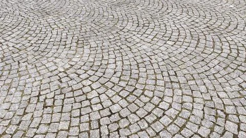 Cobblestone pavement texture background. Cobblestone pavement background. Stock Photos