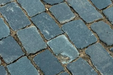 Cobblestone pavement texture top view. Ancient stone blocks of a city stree.. Stock Photos