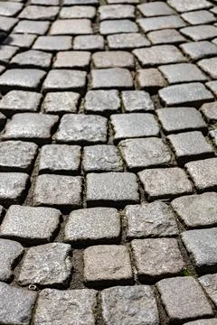 Cobblestone paving on old road background texture Stock Photos