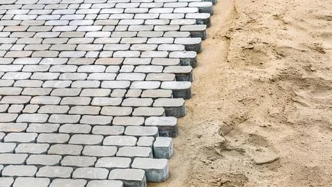 Cobblestone paving in progress on sand foundation 写真素材