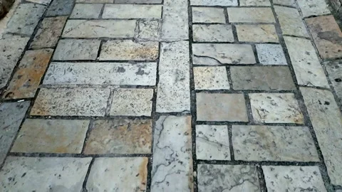 Cobblestone street - old stone blocks, aged and weathered, polished and Stock Footage 233156723