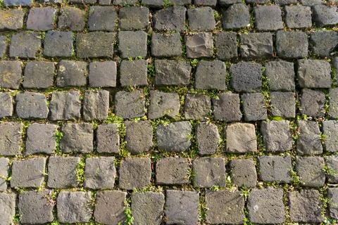 Cobblestone street pavement texture background, overhead natural stone paving Stock-Fotos