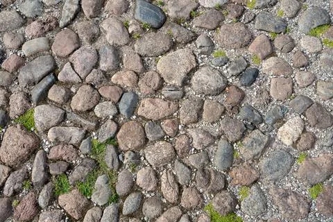 Cobblestone surface background top view. Cobblestone texture background Stock Photos