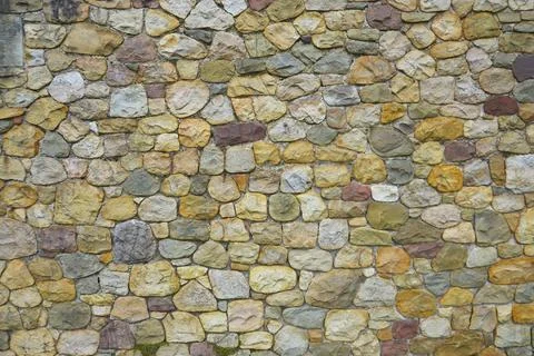 Cobblestones wall texture background, close up design Stock Photos