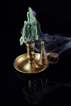 Cobweb covered candlestick Stock Photos
