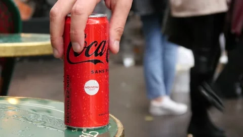 Coca-Cola aluminium Can left on the Table of Street Cafe in Paris, rainy Day Stock Footage 164591099