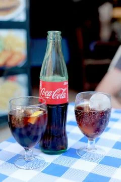 Coca Cola bottle and two glasses Stock Photos