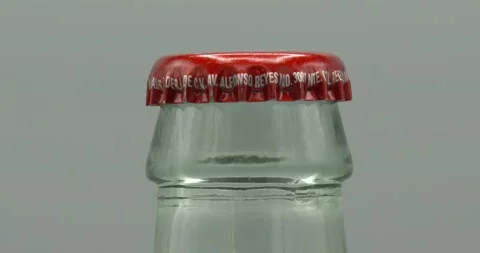Coca-Cola Bottle - Bottle Cap - Glass Bottle - Rotating Stock Footage 195771421