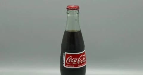 Coca-Cola Bottle Rotating - Glass Bottle - Medium Shot Stock Footage 195771127