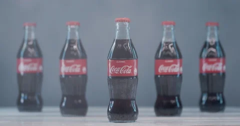 Coca Cola bottles in a blizzard and flashing light. Stock Footage 145281735